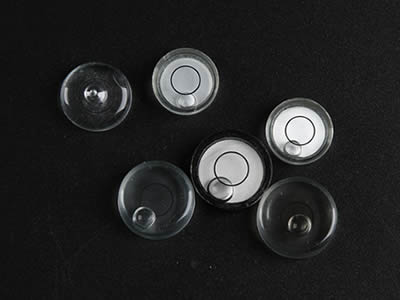 Six glass circular bubble level vials with three without base and three with aluminum base.
